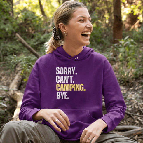 Introducing the ultimate escape gear for all the weekend warriors, the "Sorry. Can't. Camping. Bye." hoodie! This isn't just any ordinary piece of clothing; it's your ticket to avoiding all unwanted plans, chores, and responsibilities.